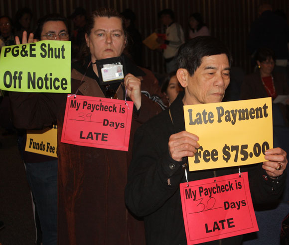 Home care workers holding signs