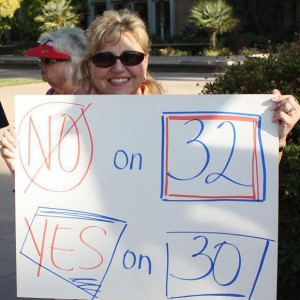 Regina Kane, an SEIU 521 member in Kern County holding her own sign.