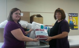 The Women's Caucus donated 15 new pillows and blankets 